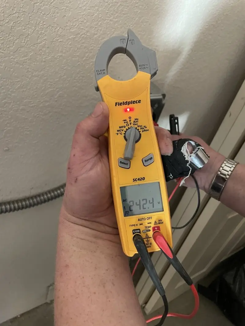 Voltage testing with clamp meter during Recessed Lighting Installation in Dacono